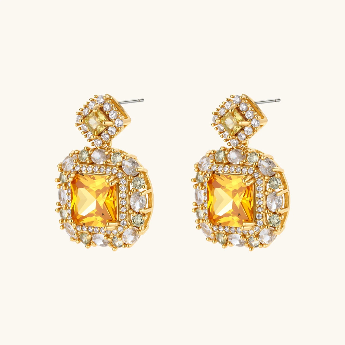 14K gold-plated jewelry set featuring square-cut cubic zirconia stones in ornate layered settings on white background.