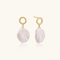 18K gold vermeil twisted circle studs with organic white baroque pearl drops on cream background